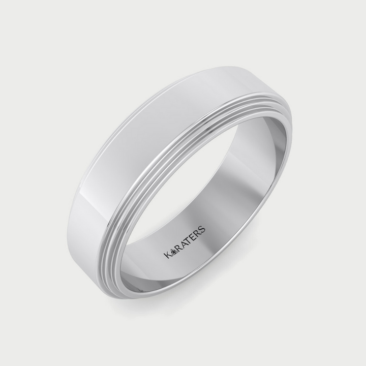 Silver ring with 'KARATERS' branding on a light gray background