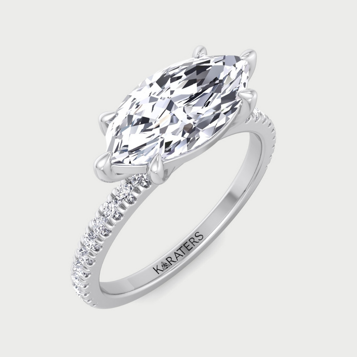 Silver ring with a large marquise-shaped diamond on a light gray background