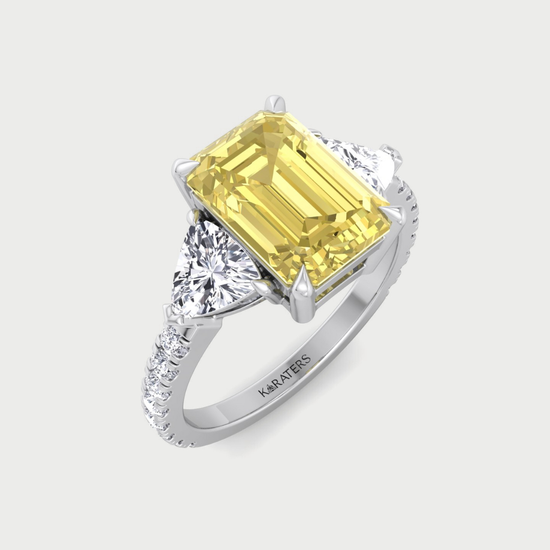 fancy yellow emerald-shaped lab-grown diamond engagement ring with trillion and pave side stones