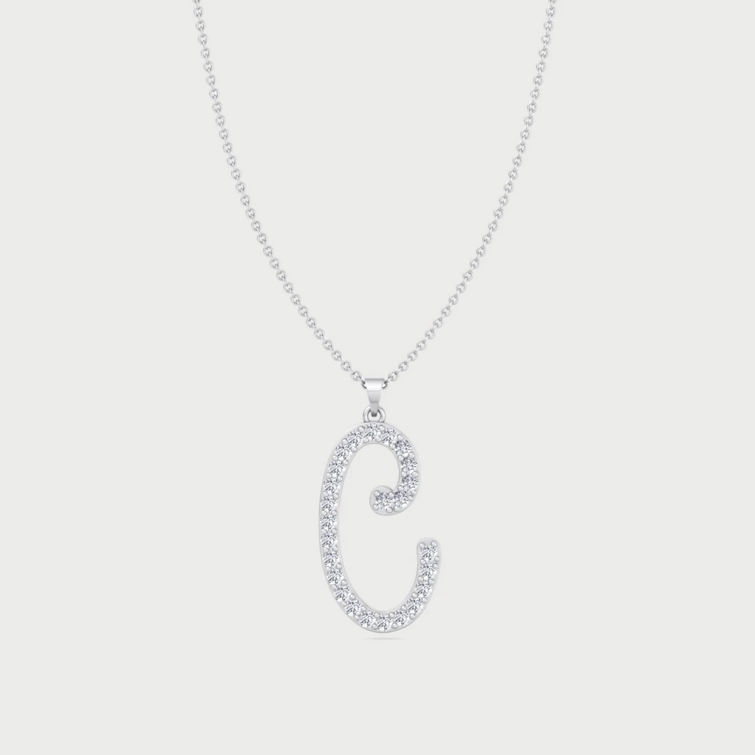 Silver necklace with a 'C' pendant on a light gray background