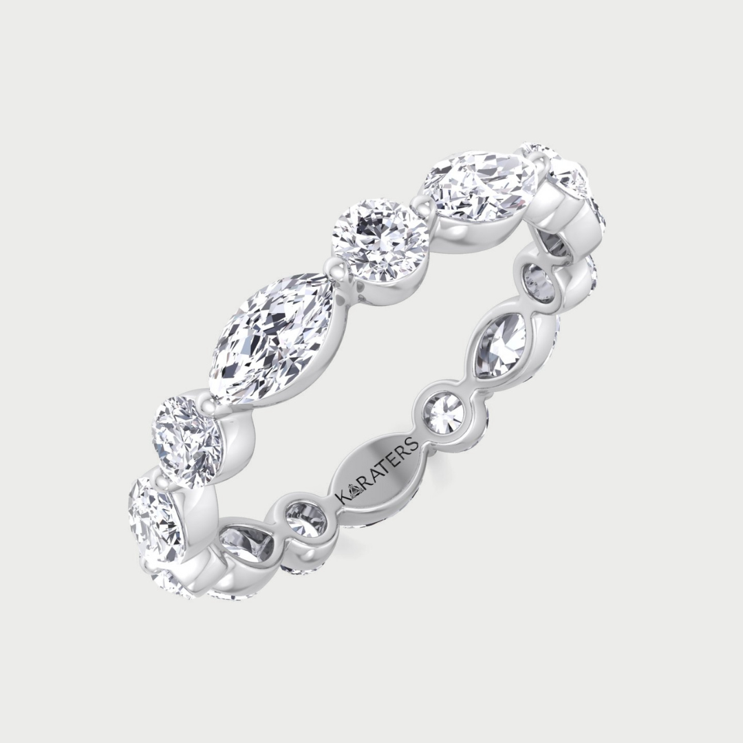 Silver ring with multiple gemstones on a light gray background