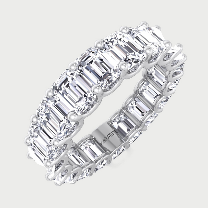 Emerald cut lab grown diamond eternity band in white gold.
