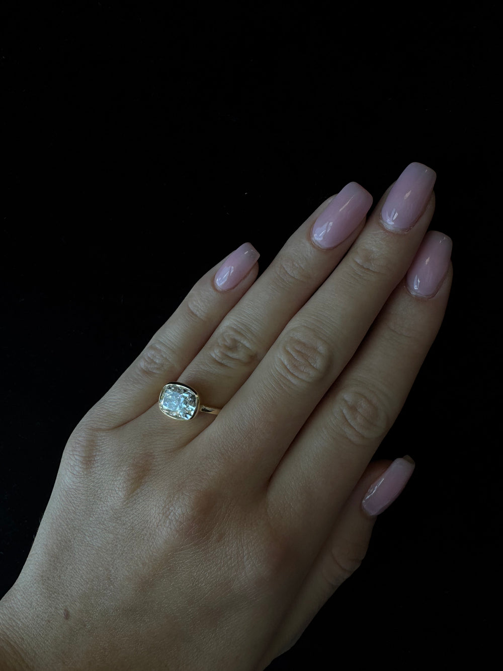 Elongated cushion cut east-west lab-grown diamond bezel engagement ring in 14K rose gold, LDEC102