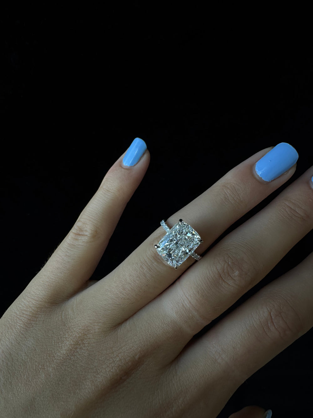 elongated cushion cut lab-grown diamond engagement ring with side stones and hidden halo