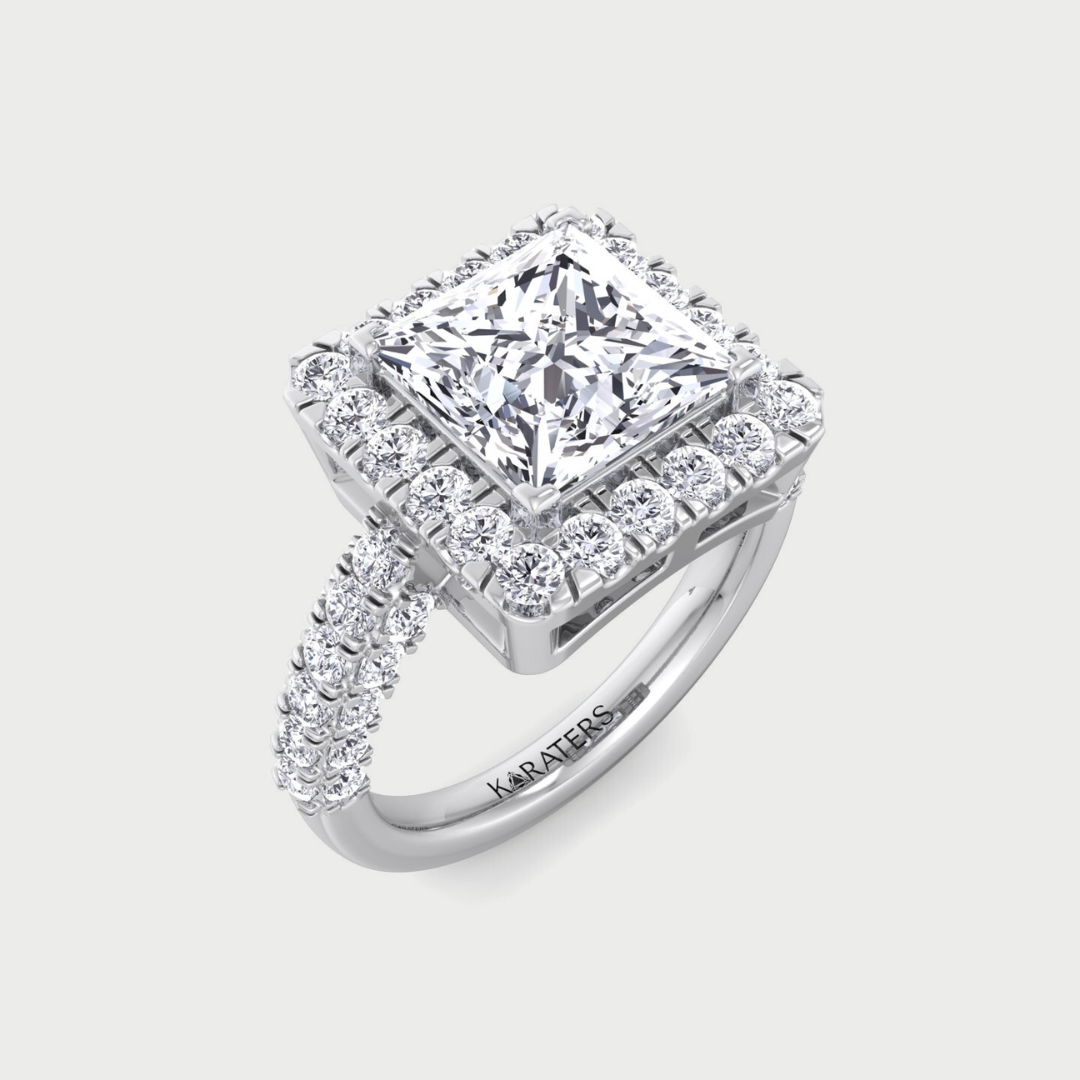 Diamond ring with a prominent central stone and smaller stones around on a light gray background
