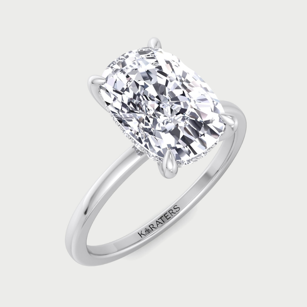Two-tone elongated cushion cut solitaire lab-grown diamond engagement ring.