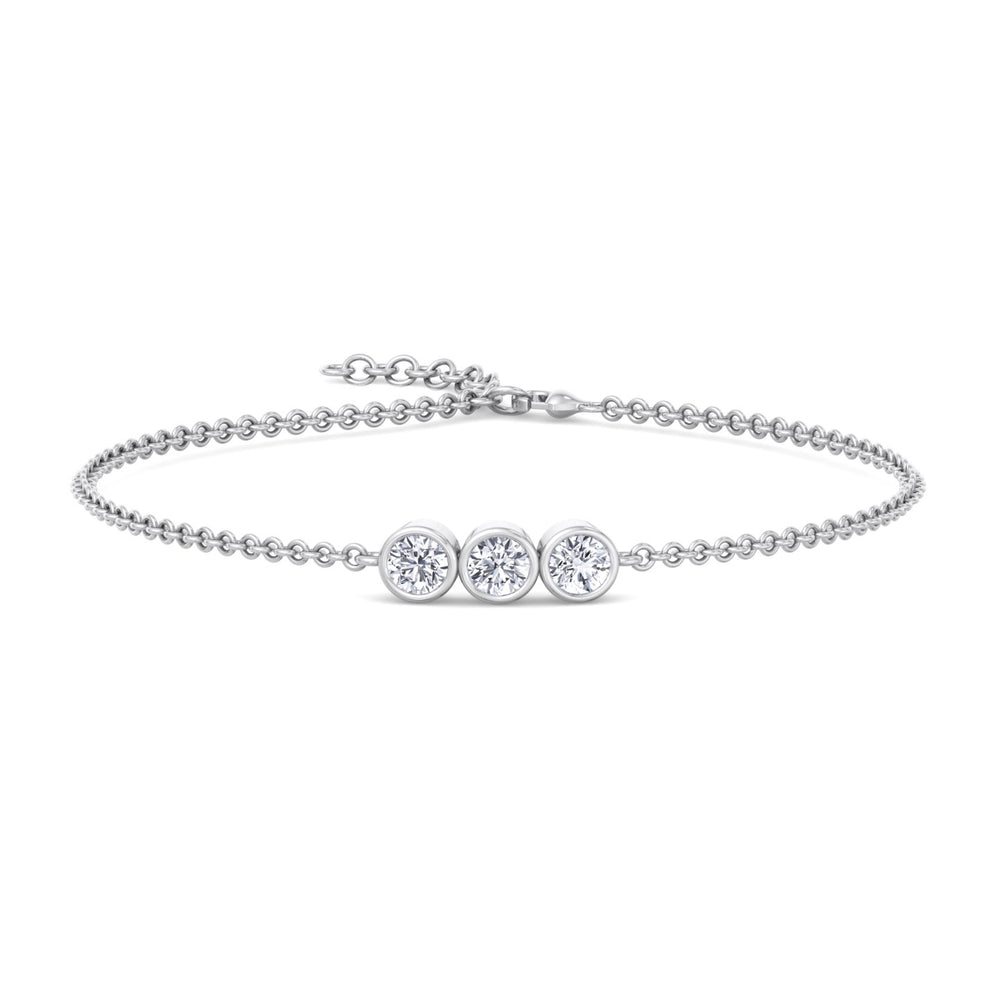 A white gold rolo chain bracelet with three bezel-set lab-grown diamond stones on a light background.