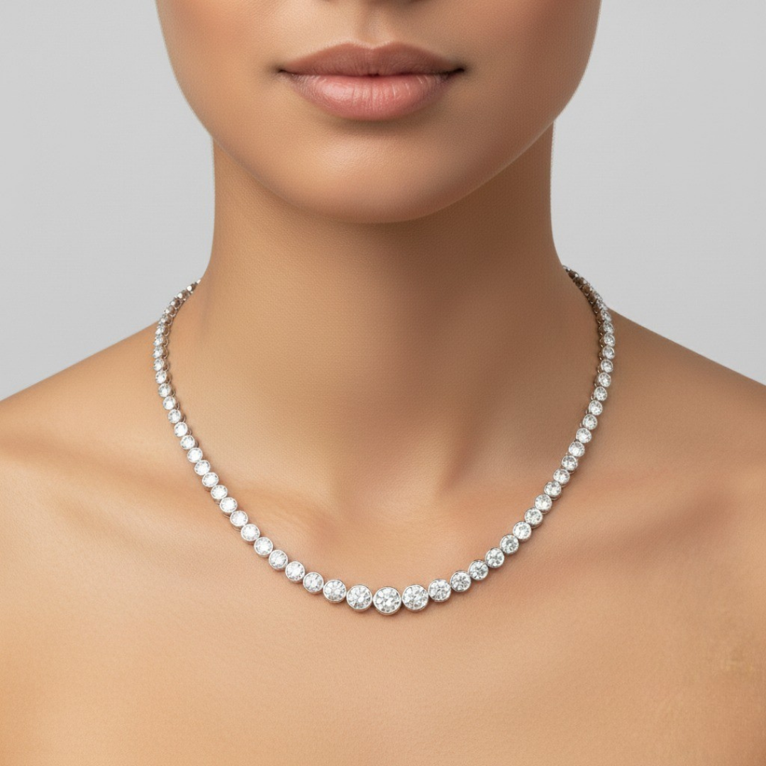 Pearl necklace worn by a model on a plain background