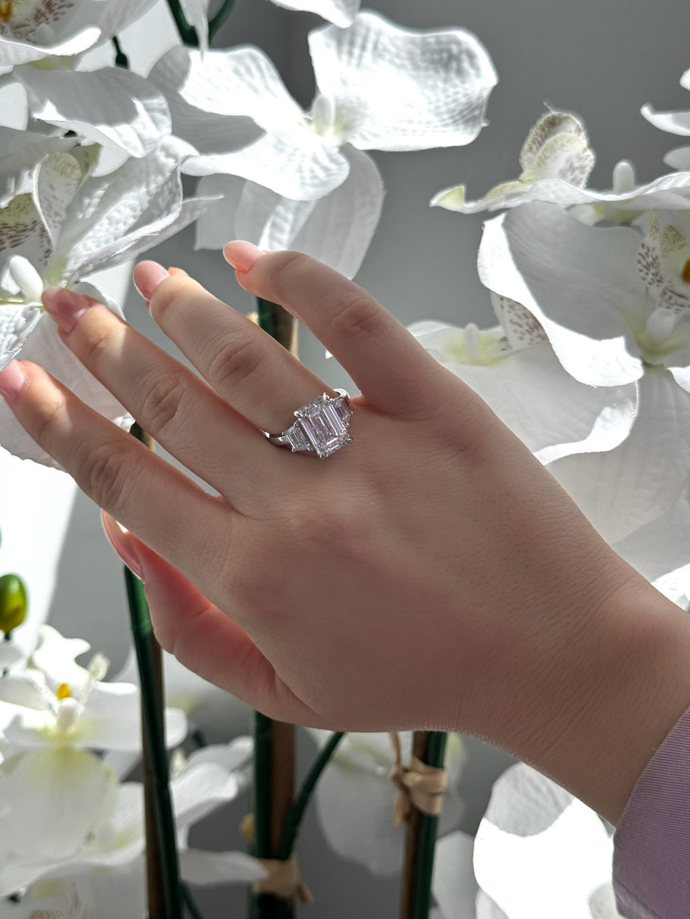 Emerald & Trapezoid Three Stone Lab-Diamond Engagement Ring, On Finger