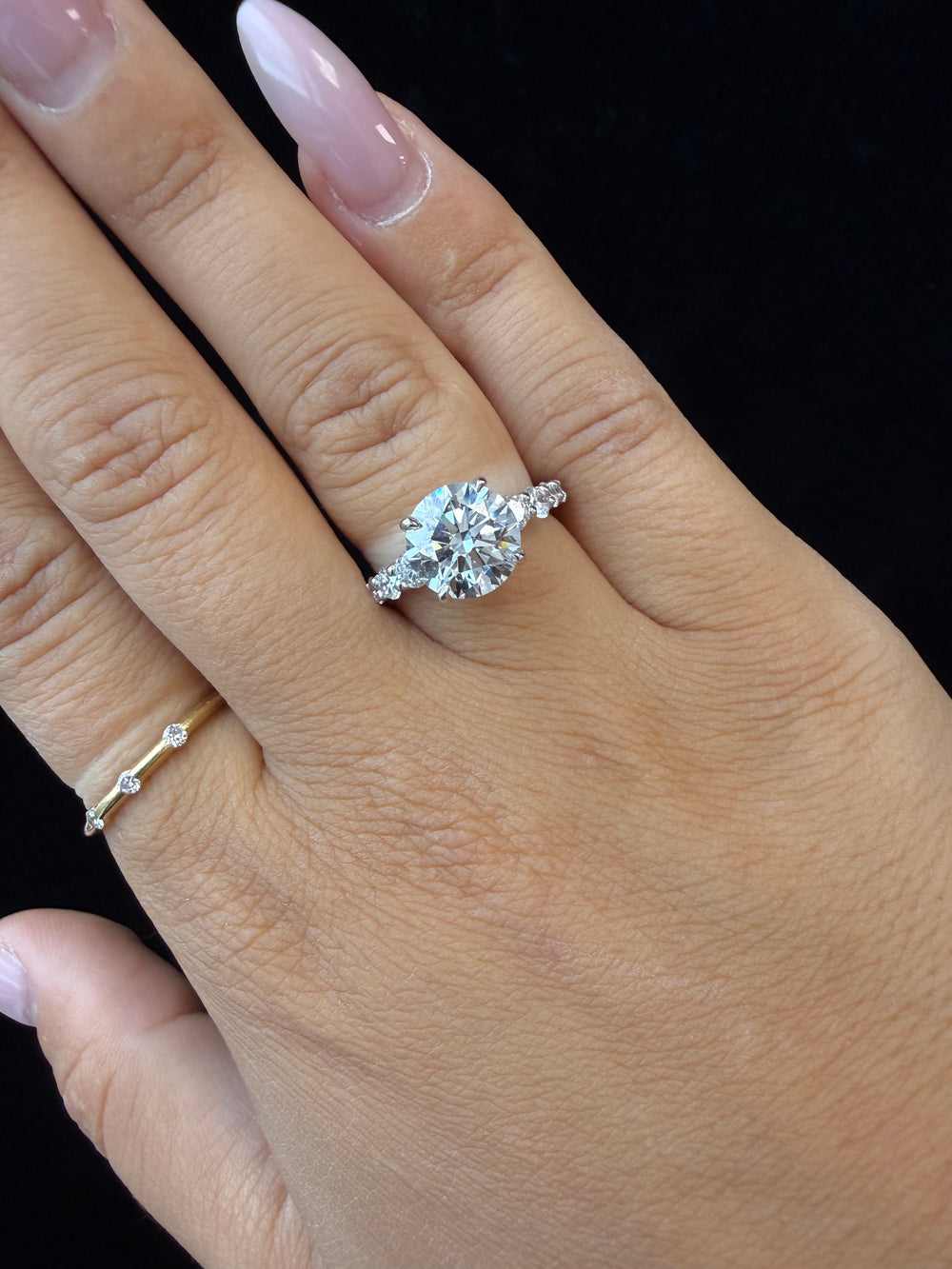 Round Shape Lab Grown Diamond Engagement Ring with Graduated Sidestones Lifestyle 
