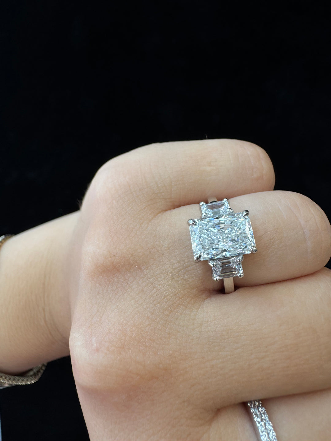 Radiant Cut Lab Grown Diamond Engagement Ring with Emerald Sidestones