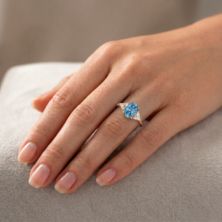 Fancy Blue Oval Shape Lab Grown Diamond Engagement Ring with Trillion Sidestones Rose