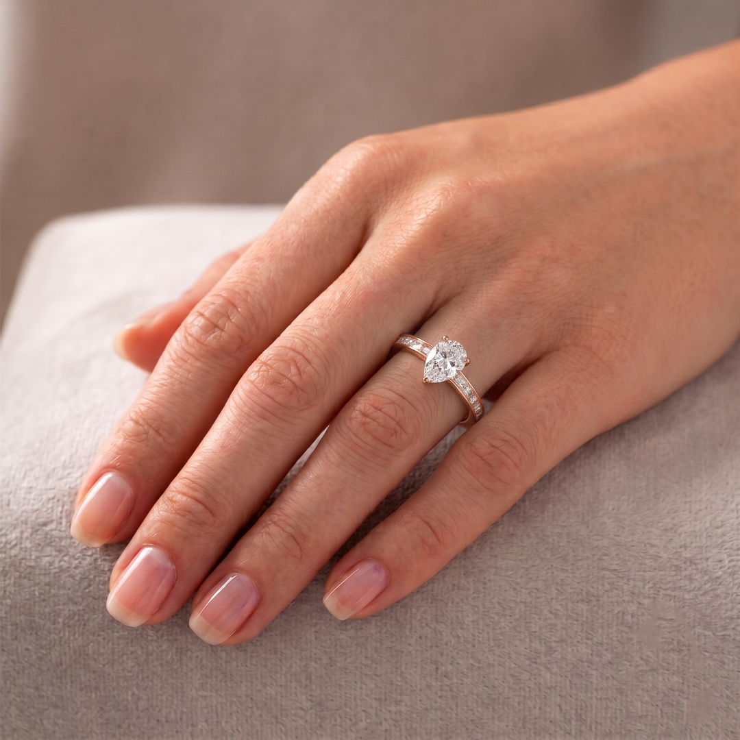 Pear Shape Lab Grown Engagement Ring with Channel Set Baguette Shape Side Stones