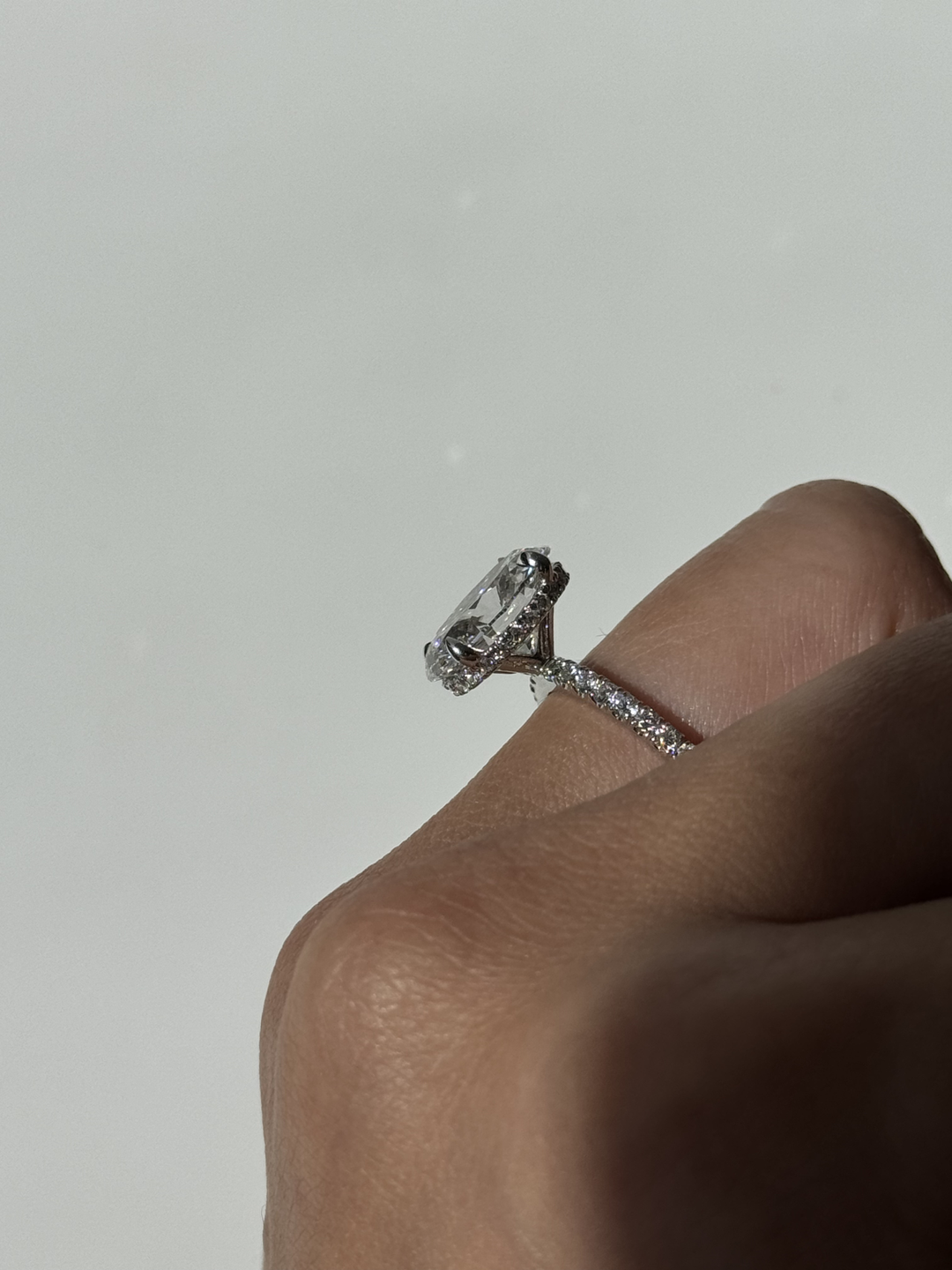 Oval Cut Lab-Grown Diamond Invisible Halo Engagement Ring With Sidestones