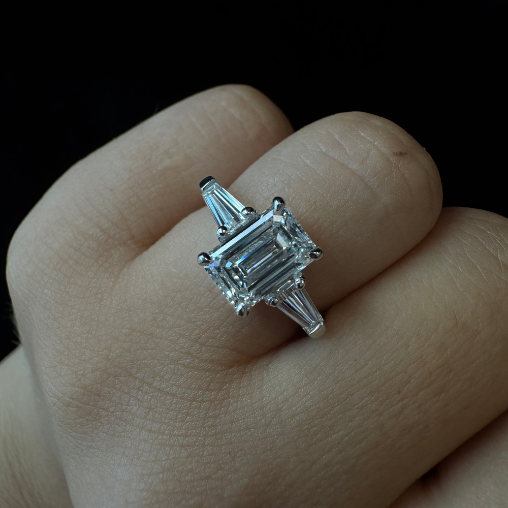 Emerald cut lab-grown diamond solitaire engagement ring with tapered baguette side stones in platinum, EBS707.