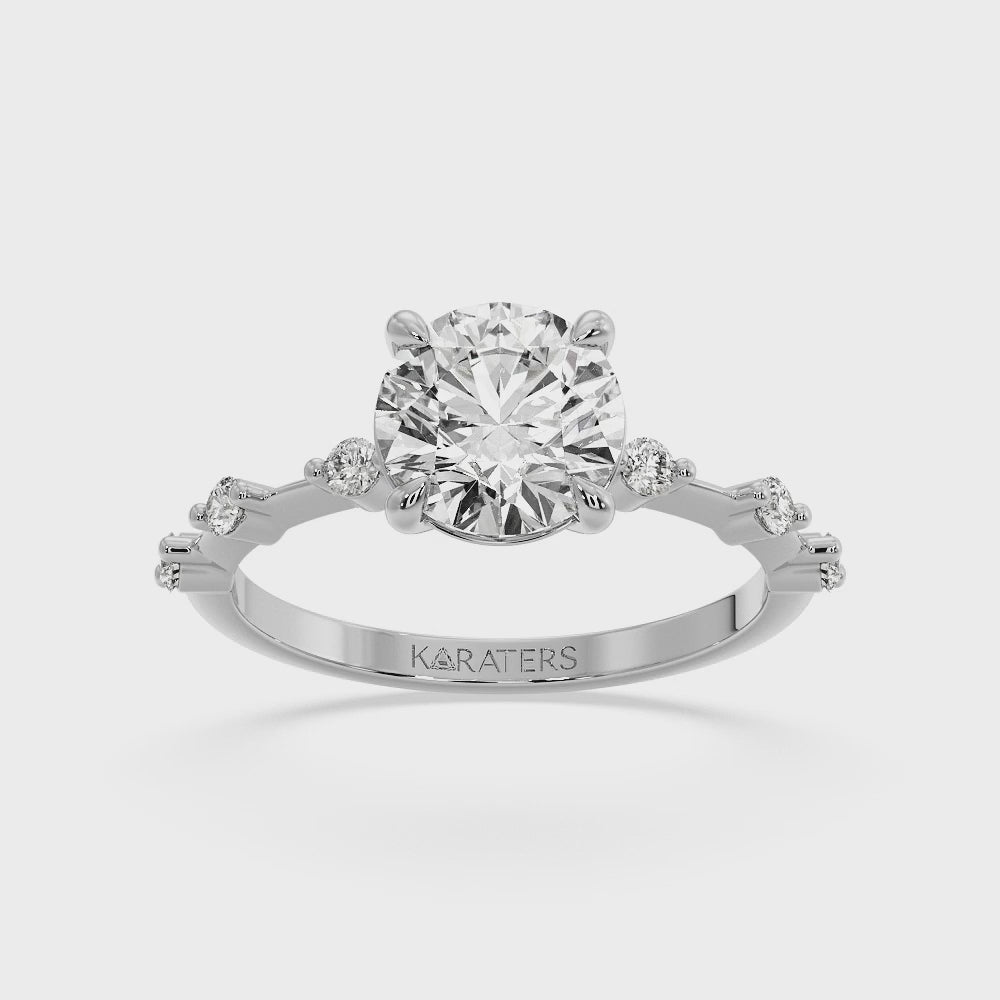 round-cut-solitaire-lab-grown-diamond-engagement-ring-with-sidestones-solid-white-gold-band